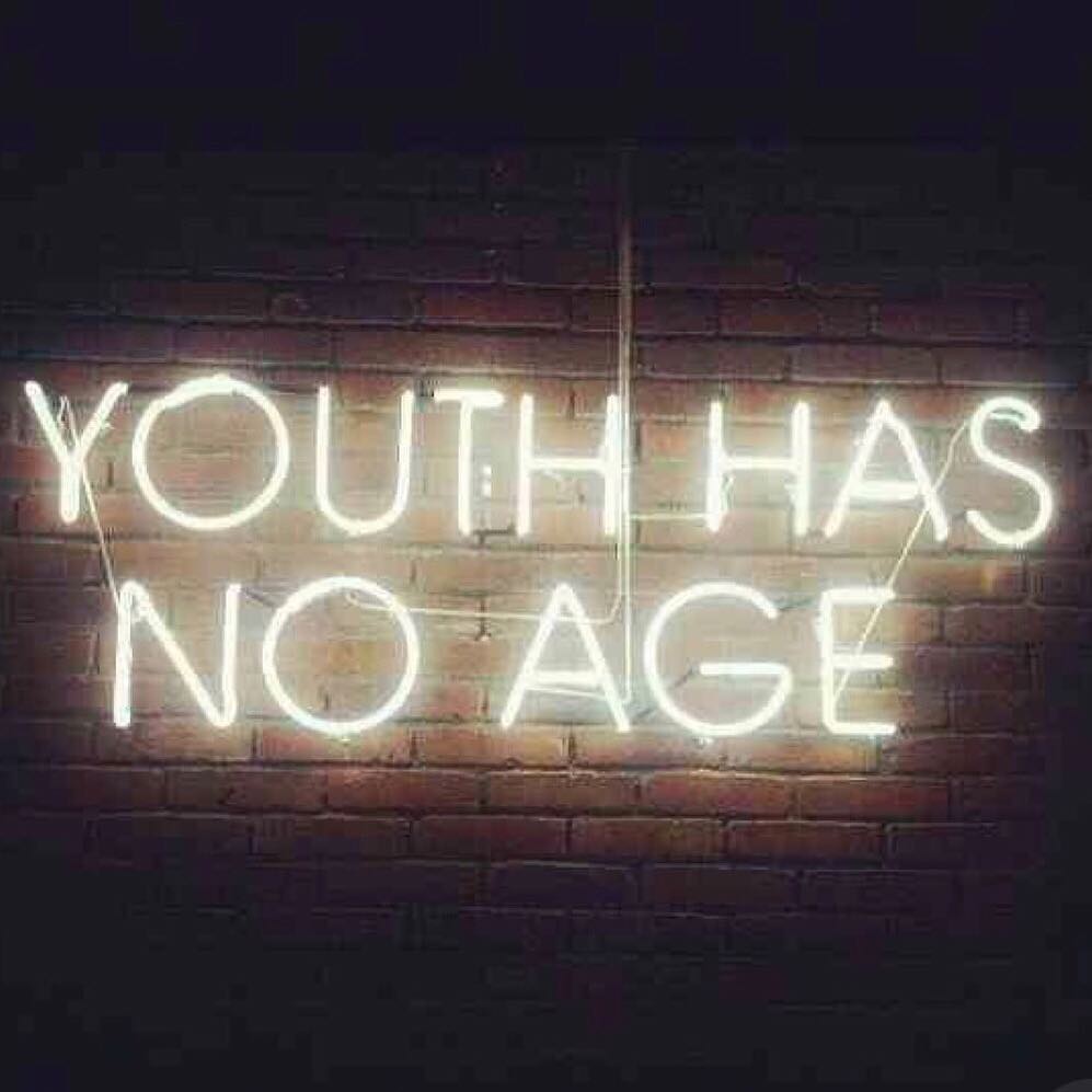 "youth has no age" sign on a wall A sign on a wall saying "youth has no age"