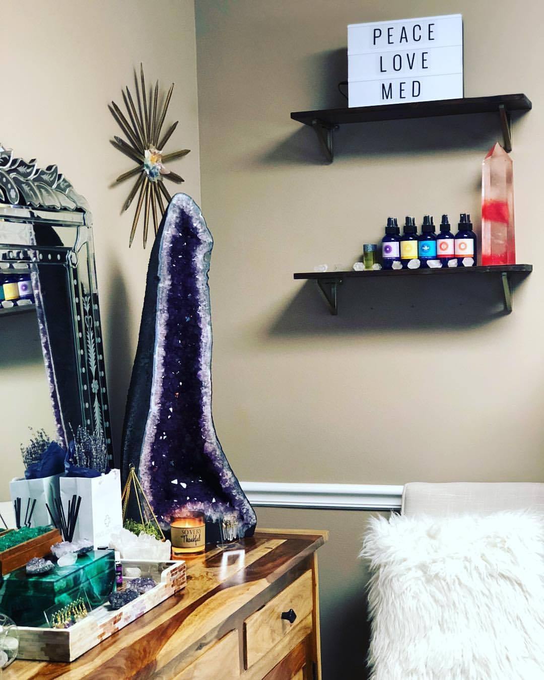 Peace.Love.Med.'s room with an amethyst rock One of the rooms of Peace.Love.Med. with an amethyst rock on a table