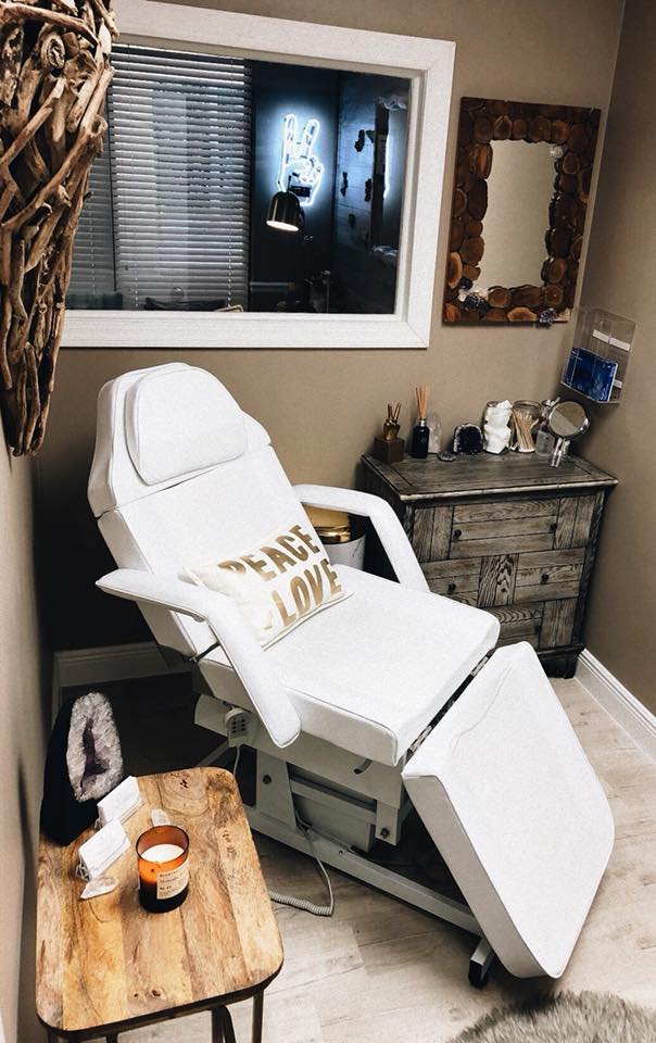 A patient's chair at Peace.Love.Med. with a pilow A patient's chair with a Peace.Love.Med. pillow on it